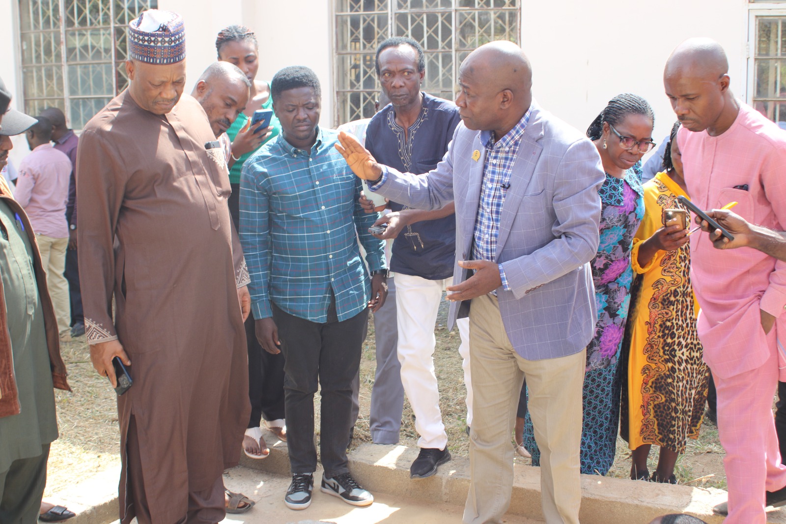 Prof. Wuyep Describing the  Innovative Toilet Facilities to the VC