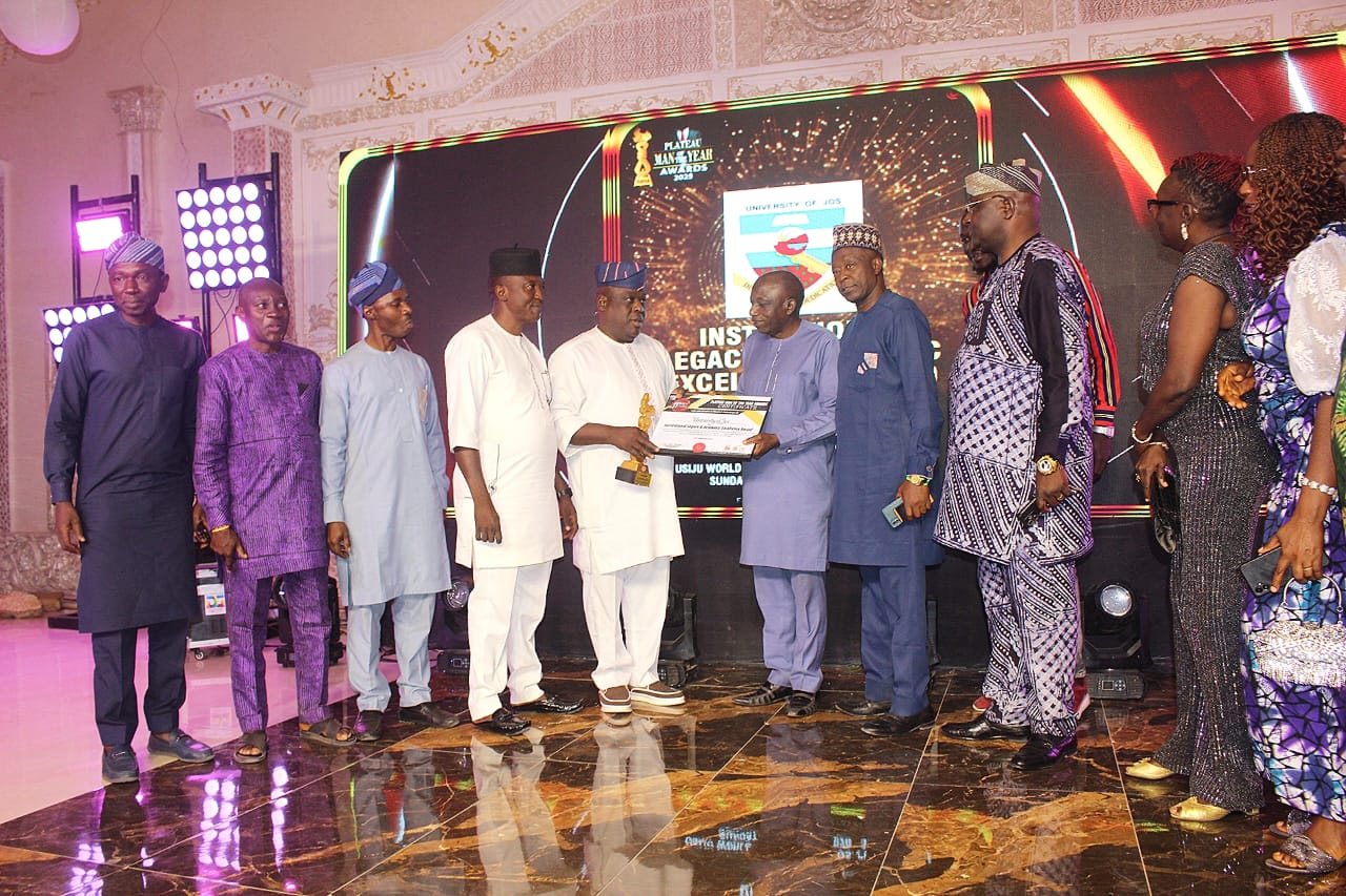 Professor J. P Chollom (DVC Academic) receiving the Award on behalf of Management