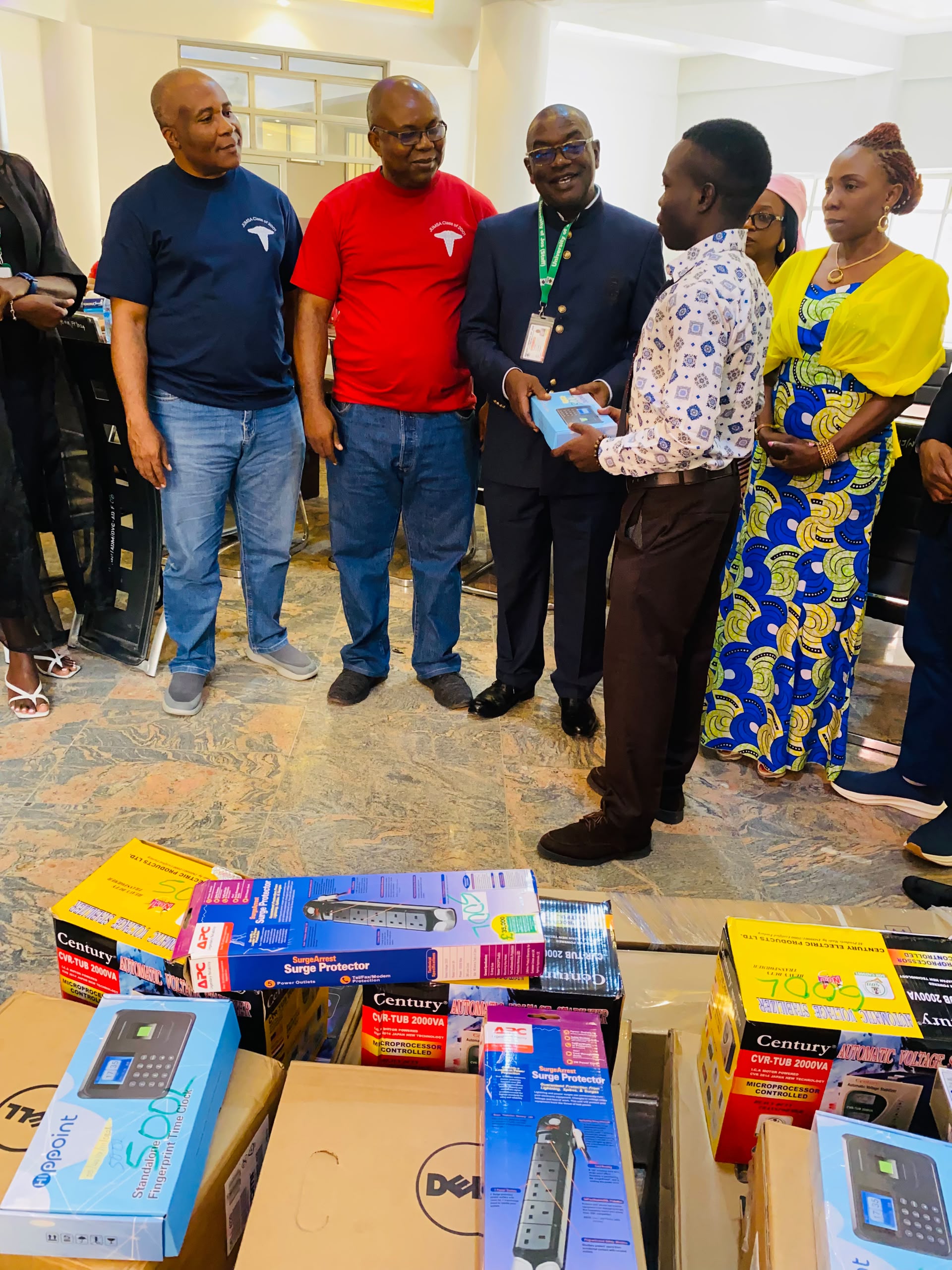 Symbolic presentation of the donation to a representative of the Students
