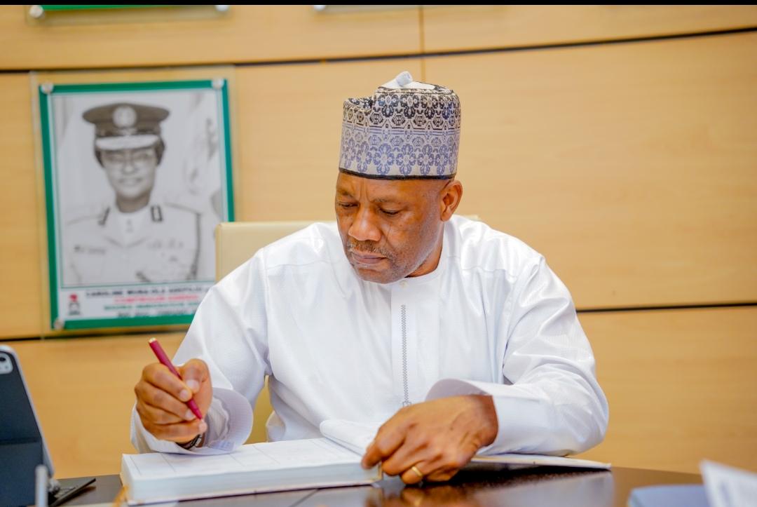 The VC signing the NIS visitors book