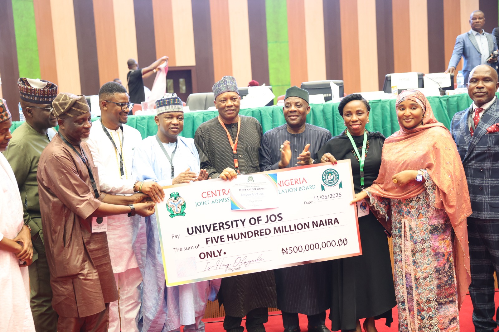 The Hon Minister of Education - Dr. Maruf Tunji Alausa, Hon Minister of State Education- Prof. Suwaiba Sa'idu Ahmad, Chairman Senate Committee on Tertiary Education and TETFund -Dandutse Muntari Mohammed, Chairman Senate Committee on Cybersecurity, The JAMB Registrar – Prof. Ishaq Oloyede and Other stakeholders presenting the N500,000,000.00  top Prize to the Vice-Chancellor, Professor Tanko Ishaya accompanied by the University Registrar