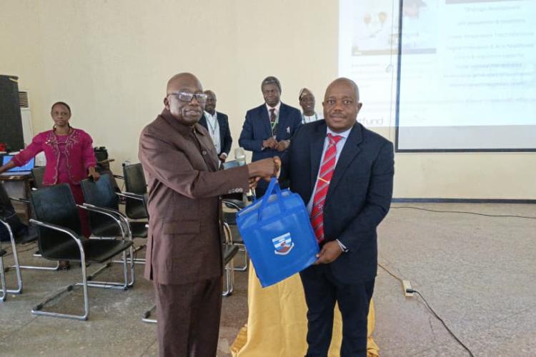 DVC Academic Professor Joshua Pam Chollom Representing the VC being presented a gift at the Training,.jpg