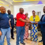 Chairman of the Class handing over an item to the Global President Unijos Alumni Asspciation Comrade Peter Gad Shamaki