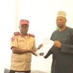 FRSC Sector Commander presenting the condolence letter to the VC