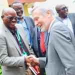 HE Ambassador Gautier Mignot in a warm handshake with Dean of Students Affairs  Professor Chris Piwuna