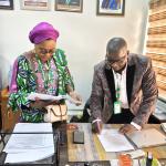 Mr. Philip Umbugala signing the handover notes