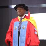 Professor Asura standing as his citation is read.jpg