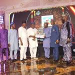 Professor J. P Chollom (DVC Academic) receiving the Award on behalf of Management