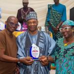 VC receiving the award falanked by hi wife on the left and Dean Students Affairs on the right..jpg