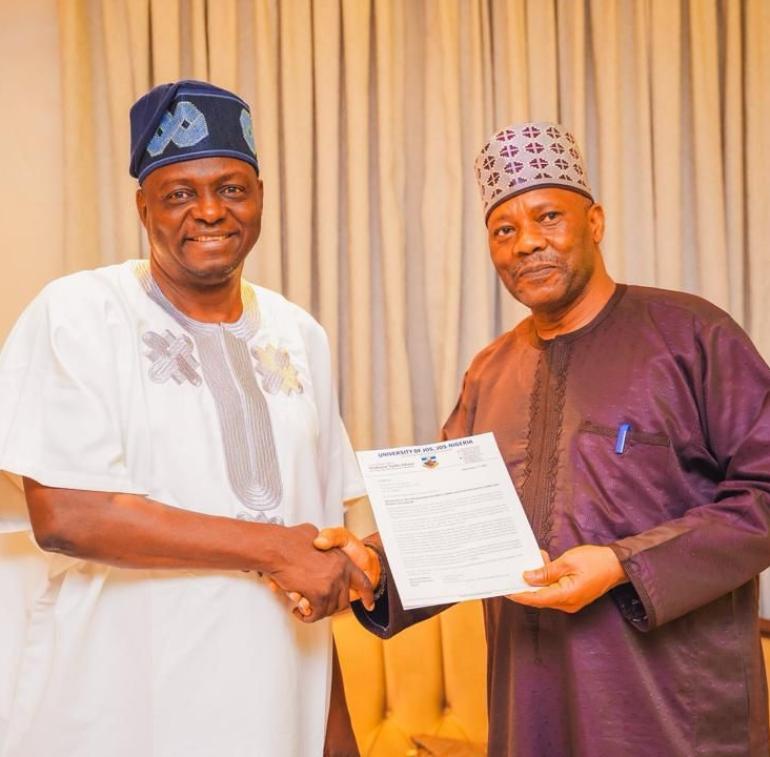 The APC National Chairman, Prof. Nentawe Yilwatda (left) receiving the letter of invitation from the Vice Chancellor, Prof. Tanko Ishaya during the visit.