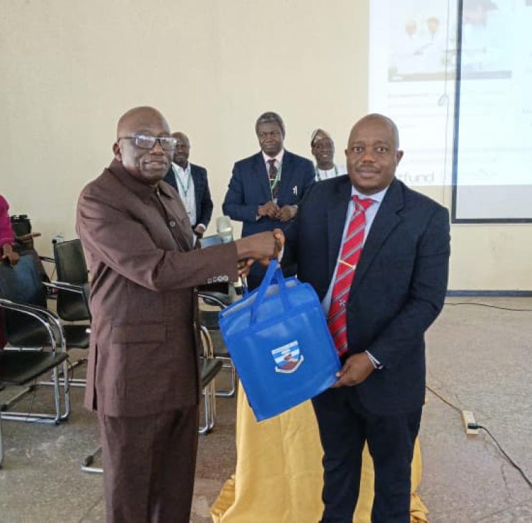 DVC Academic Professor Joshua Pam Chollom Representing the VC being presented a gift at the Training,.jpg